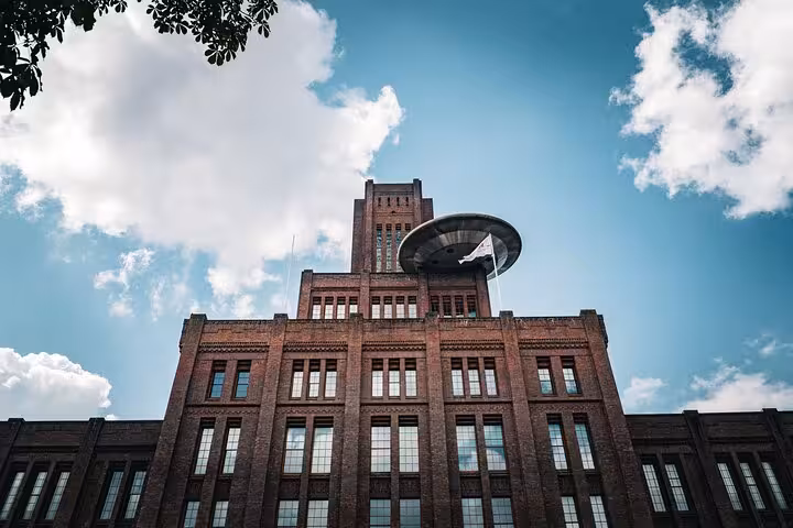 Low-angle view of Utrecht’s historic brick landmark on a small-group city tour, with optional add-on experiences