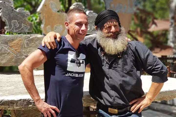 Two men enjoying the cultural experience at Toplu Monastery during a luxury tour in Crete.