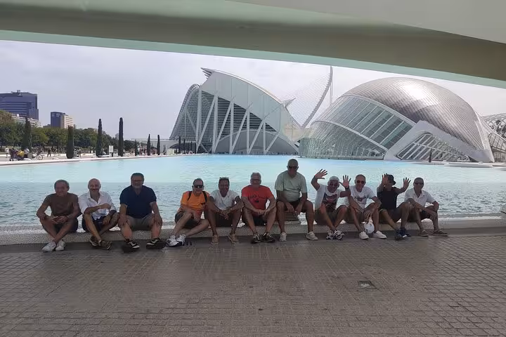 Friends with rental bikes at Valencia City of Arts and Sciences on Ruzafa guided bike tour highlights