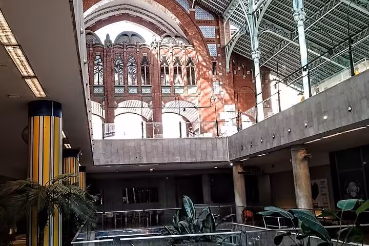 Interior of Valencia Central Market on a gourmet tapas tour by bike or on foot, modern atrium view