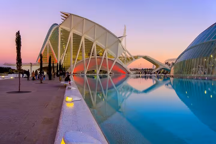 Sunset at Valencia City of Arts and Sciences reflecting in water on scenic e-bike tour from the beaches