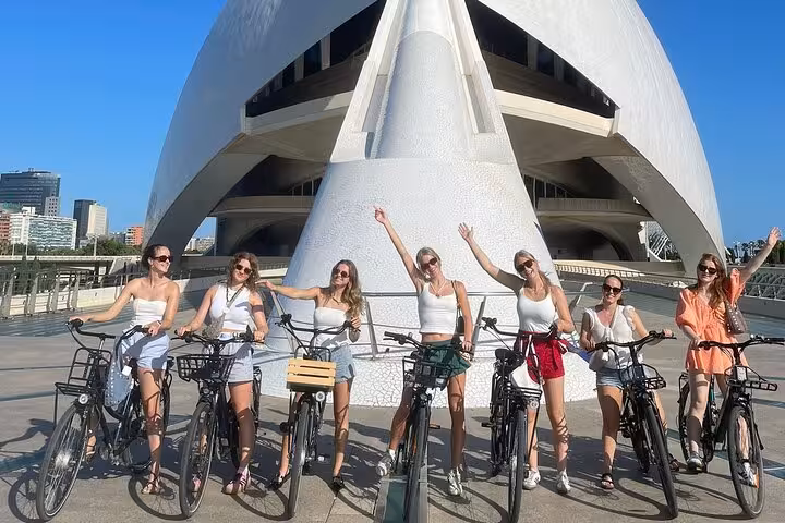 Riders with e-bikes at Valencia City of Arts and Sciences, beach and old town highlights on guided tour