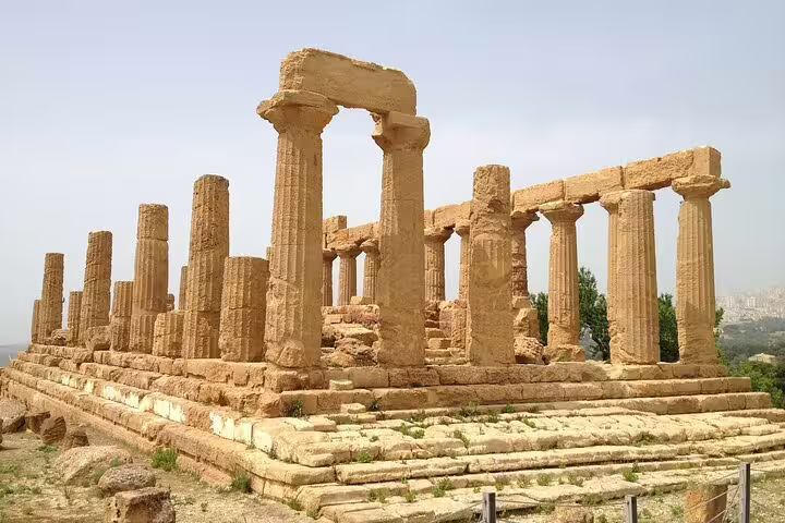 Ancient Doric temple ruins in the Valley of the Temples, Agrigento, featured on a private guided tour with Kolymbethra visit