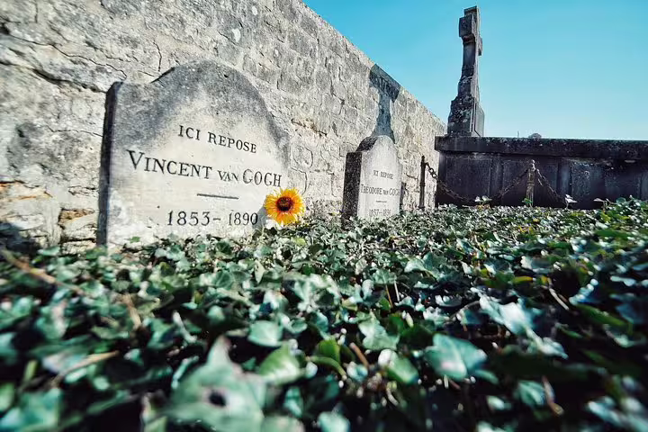 Low-angle view of Vincent van Gogh grave in Auvers-sur-Oise, memorable stop on Giverny private tour