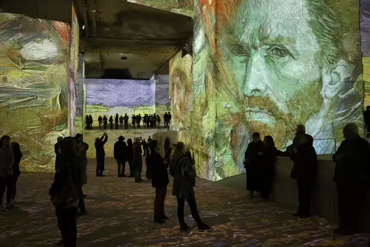 Visitors experiencing immersive Van Gogh art projection display at Les Baux de Provence Carrières de Lumières
