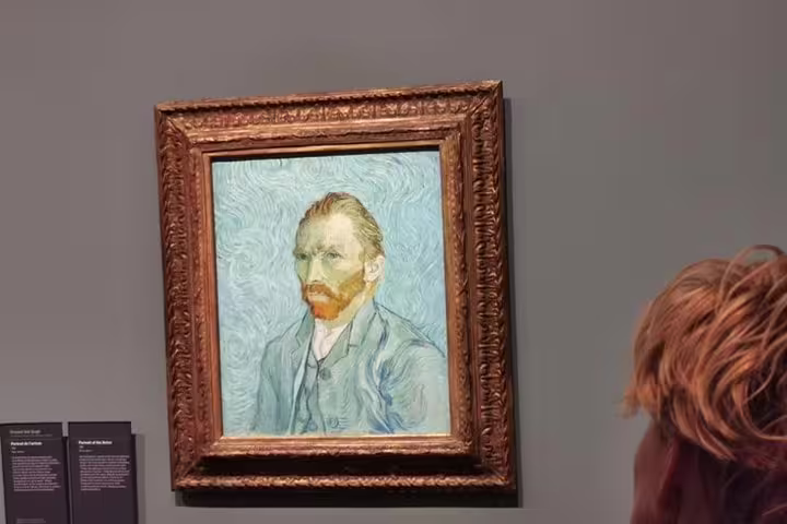 Van Gogh self-portrait on museum wall, a highlight stop on a Giverny & Honfleur private tour from Paris