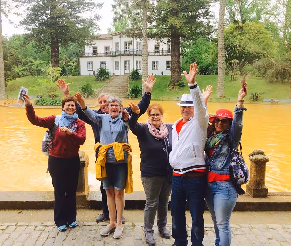 Happy group at Terra Nostra Garden hot springs in Furnas on São Miguel van lake tour full day experience