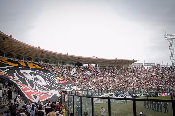 Packed Rio stadium crowd with Vasco da Gama banners during matchday tour with local guide experience