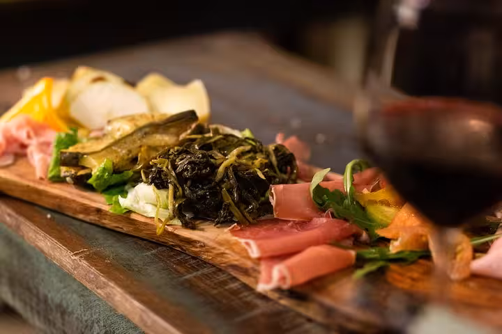 Italian antipasto platter with cured meats and vegetables on the Pope's favorite Rome food tour near Vatican.