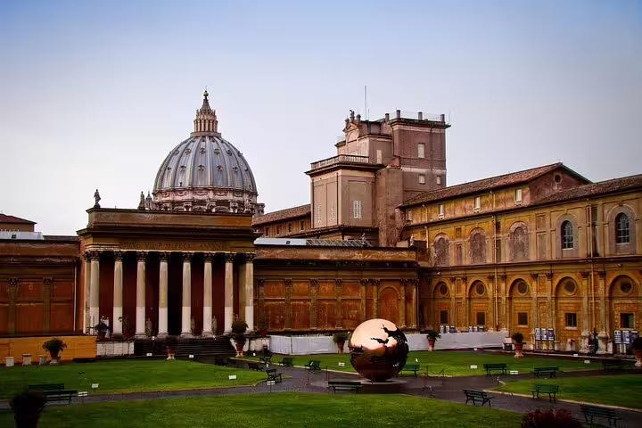Vatican Museums courtyard with St Peter’s Basilica dome, highlight on expert guided Vatican tour Rome