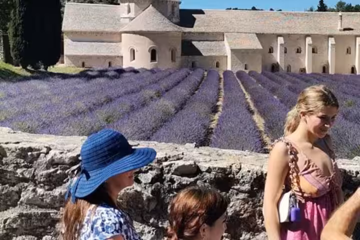 Vehicle with driver in Provence at Senanque Abbey, guests photographing lavender fields on a private day tour