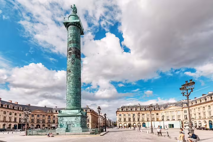 Historic Vendôme Column in Paris under a vibrant sky, part of the full-day private tour including Montmartre and Eiffel Tower.