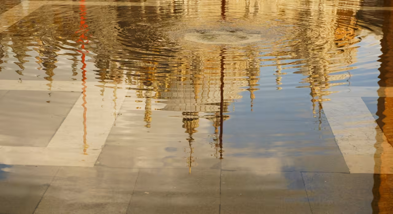 Reflection of Venetian architecture in water, capturing the essence of Venice's unique aquatic landscape.