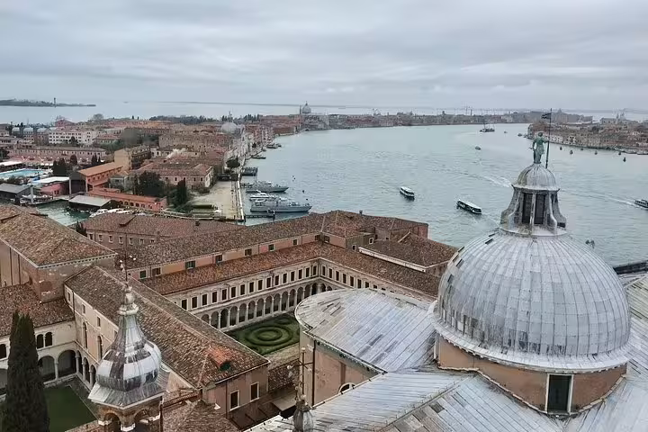 Aerial view of Venice's historic architecture and waterways, showcasing iconic domes and canals for deluxe heritage tours.