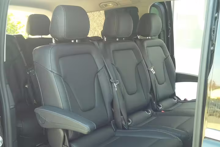 Comfortable leather interior of a transfer van, offering premium service from Venice Marco Polo airport to Mestre or Marghera.