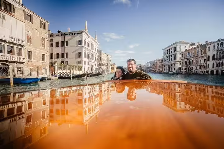 Experience the charm of Venice's canals with a scenic boat ride offering breathtaking views of historic Venetian buildings.