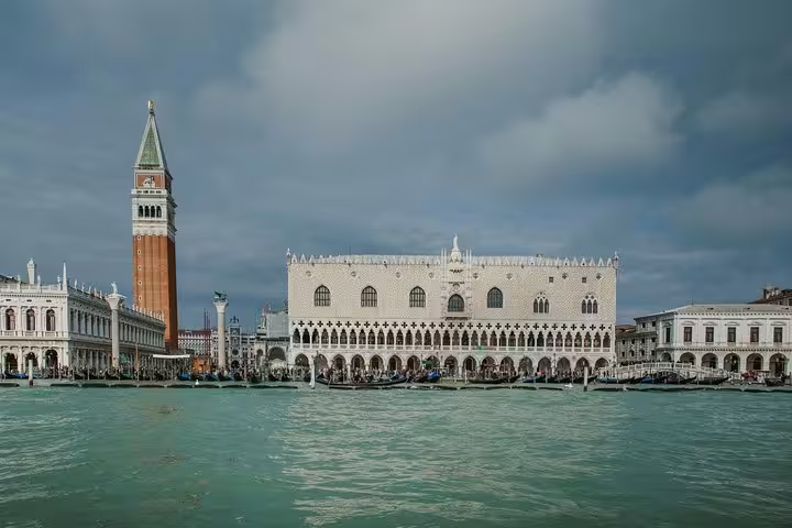 View of the Doge's Palace and St. Mark's Campanile from the water, a key sight on the Venice city tour.