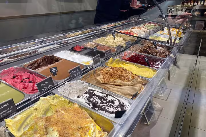 Colorful artisan gelato display at a Venice gelateria featuring local flavors on a street food tour
