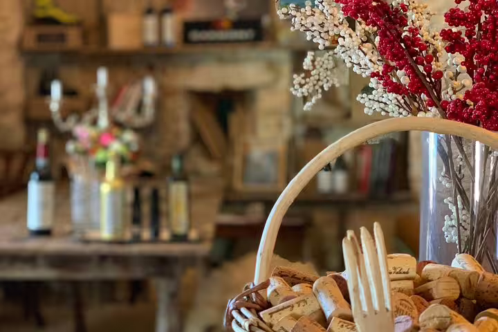 Charming rustic decor with wine corks and floral arrangements, enhancing the cozy ambiance of a scenic Venice to Milano transfer stop.