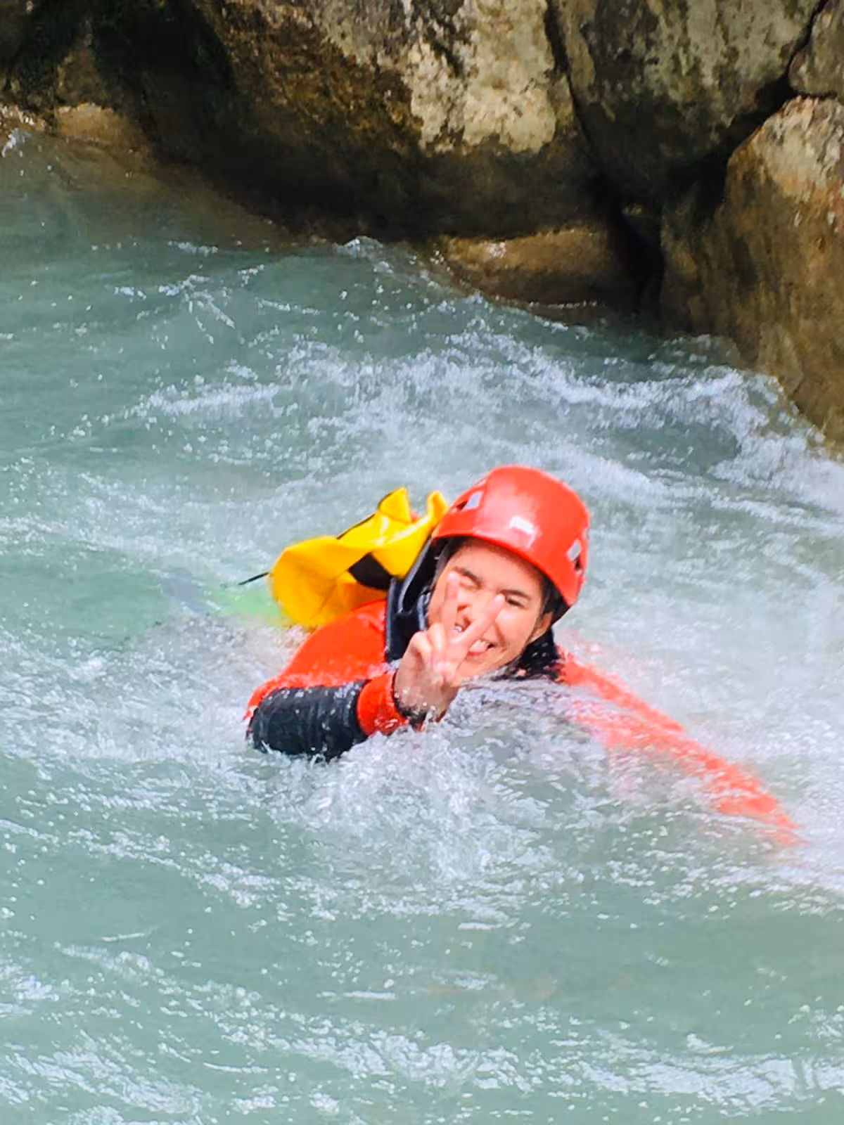 Canyoning on Verdon River, France, with helmeted adventurer swimming rapids on 6D/5N lodge trip