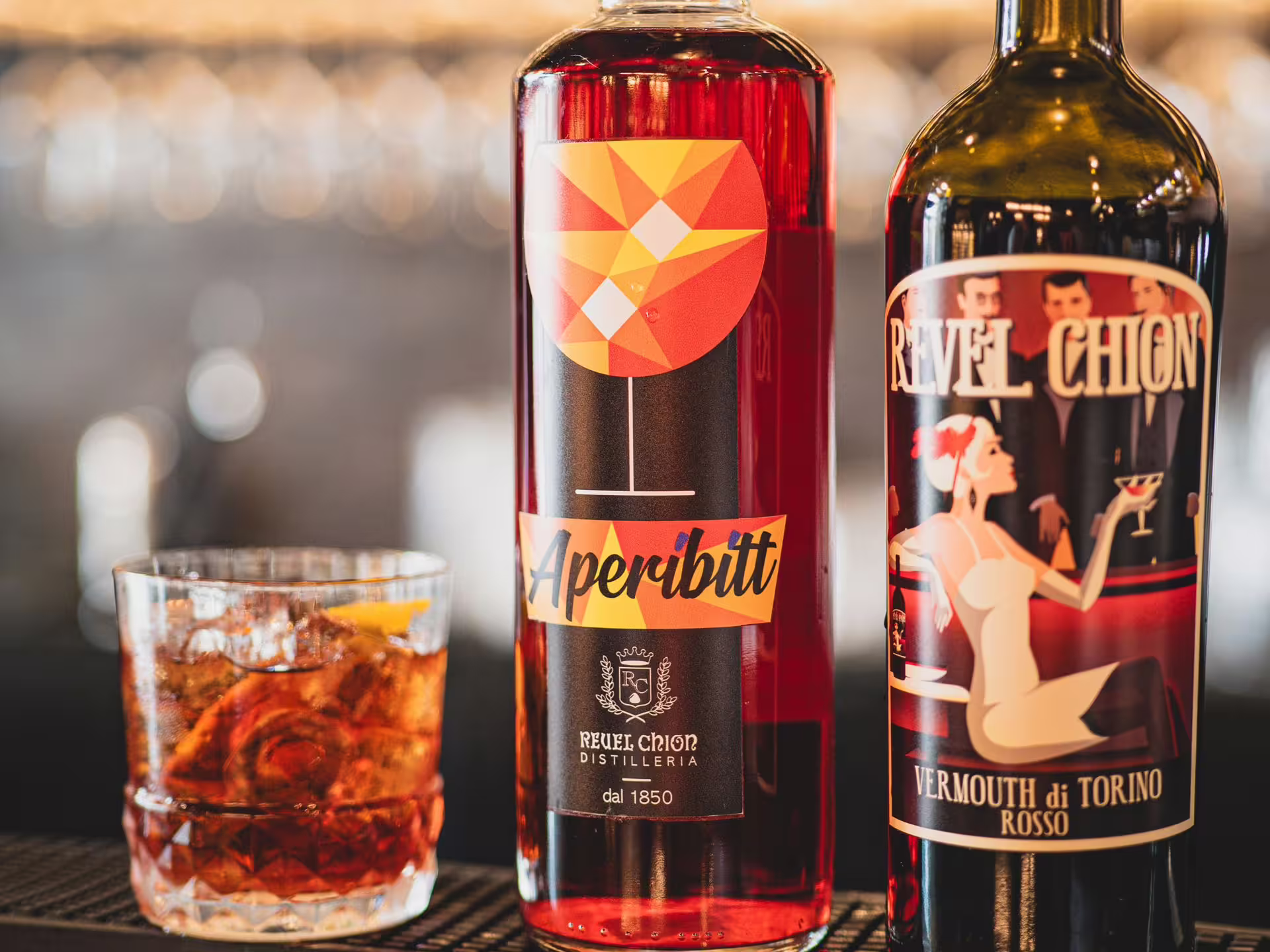 Close-up of Aperibitt and Vermouth di Torino Rosso bottles, perfect for a tasting tour near Turin.
