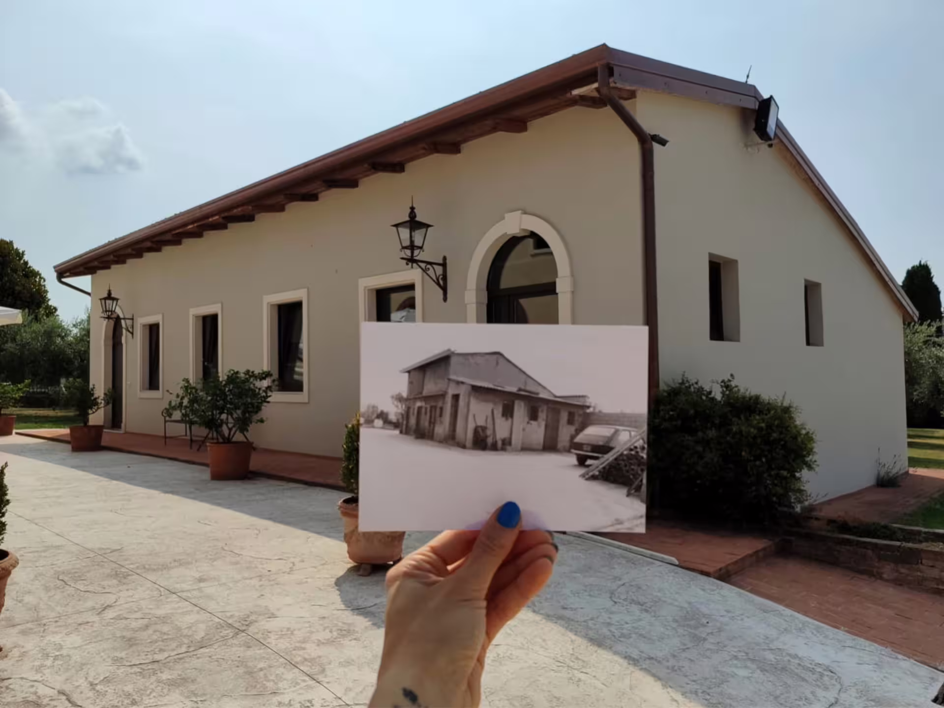 Verona countryside olive mill exterior with historic photo, welcome stop on guided olive oil tour and tasting