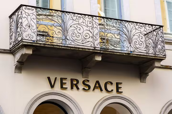 Versace store facade with ornate wrought iron balcony in Milan fashion district