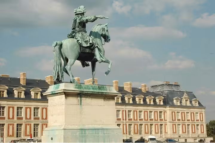 Equestrian statue in Versailles gardens near the palace, a highlight of the Versailles Grand Tour guided visit