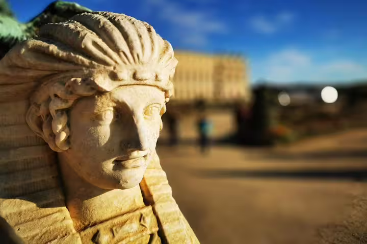 Close-up of Versailles Palace garden statue on a private guided tour with hotel pickup from Paris