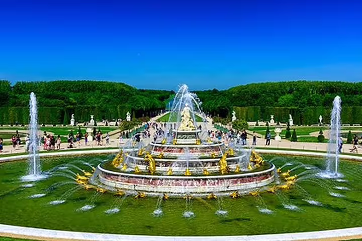 Versailles Gardens fountain view on guided tour with skip-the-line tickets, Grand Canal and statues