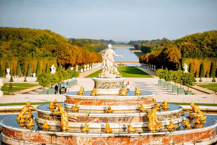 Versailles Grand Tour guided gardens view of Latona Fountain with gilded statues and Grand Canal