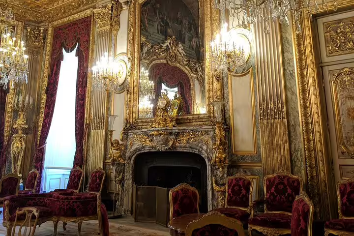 Explore the opulent interiors of Versailles with ornate decor and luxurious furnishings on our guided Parisian tour.