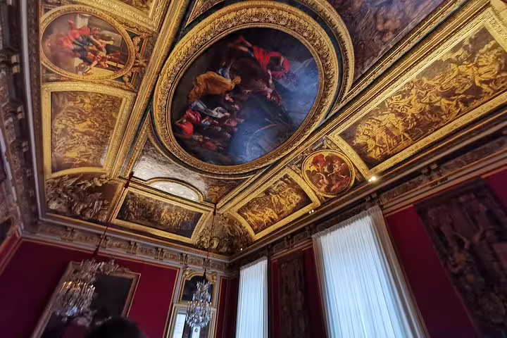 Versailles Palace ornate ceiling frescoes and gold moldings seen on guided tour with skip-the-line entry