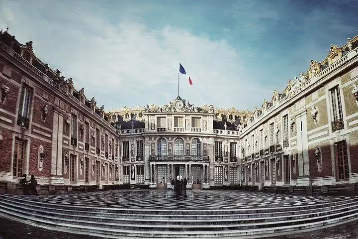 Versailles Palace courtyard facade on a private full-day tour from Paris with hotel pickup and guide