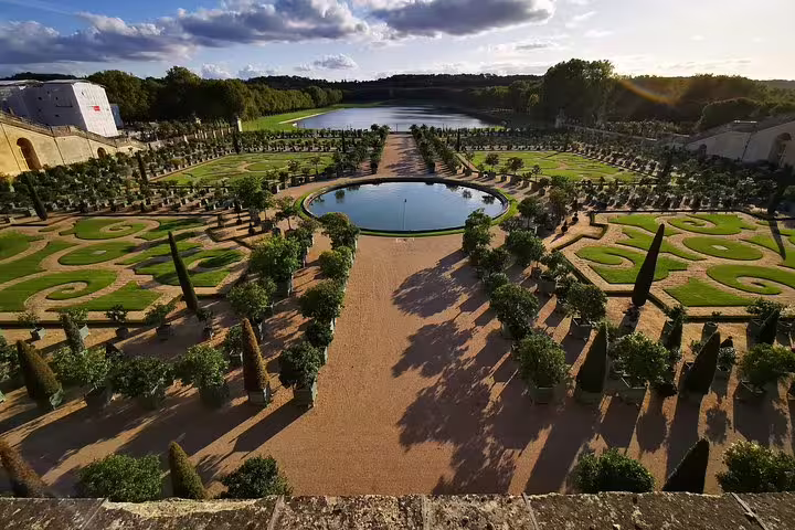 Panoramic view of Versailles Palace formal gardens and fountains, part of a full-day private tour from Paris