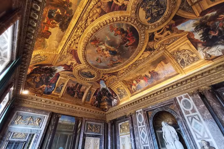 Versailles Palace guided tour view of gilded ceiling frescoes and marble halls with skip-the-line entry