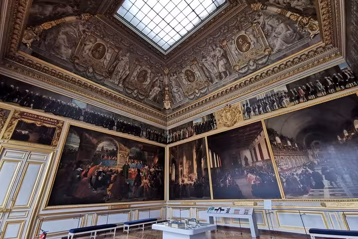 Versailles Palace guided tour room with grand ceiling frescoes and historic murals, skip-the-line entry