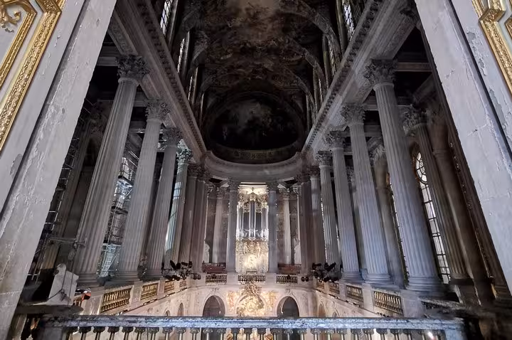 Grand chapel interior at Versailles Palace on guided skip-the-line tour, towering columns and ornate altar