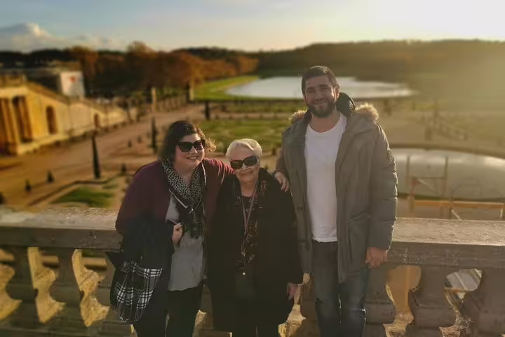 Visitors on Versailles Palace and Gardens guided tour enjoying panoramic views with skip-the-line tickets
