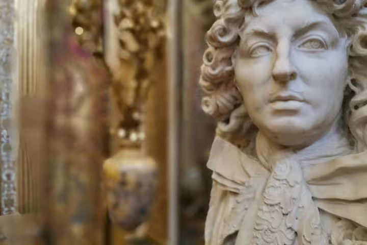 Close-up marble bust in Versailles Palace interior, part of guided tour with skip-the-line entry