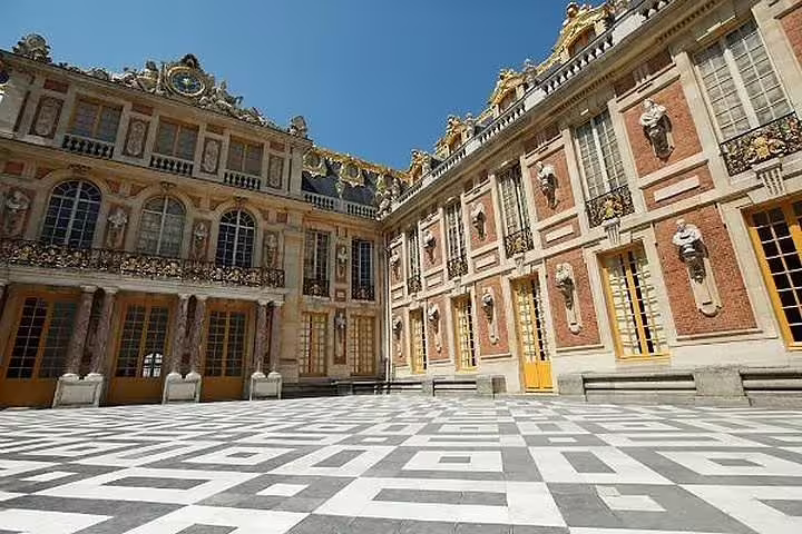 Versailles Palace Marble Courtyard with ornate facades, visited on a private guided day tour from Paris