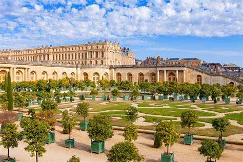 Versailles Palace and Orangerie gardens with potted trees and pathways, ideal for a full-day grand tour