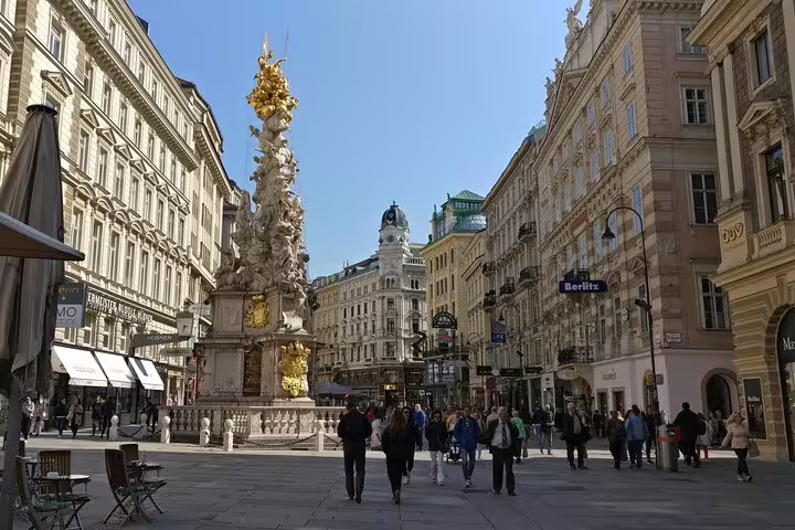 Graben street Vienna with Plague Column and historic baroque buildings on pedestrian zone