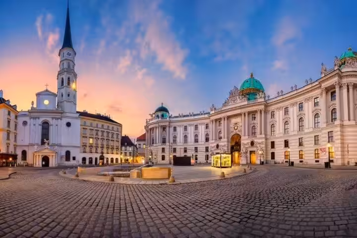 Vienna Hofburg Palace and Michaelerplatz at dusk, landmark photo from Budapest to Vienna private transfer tour