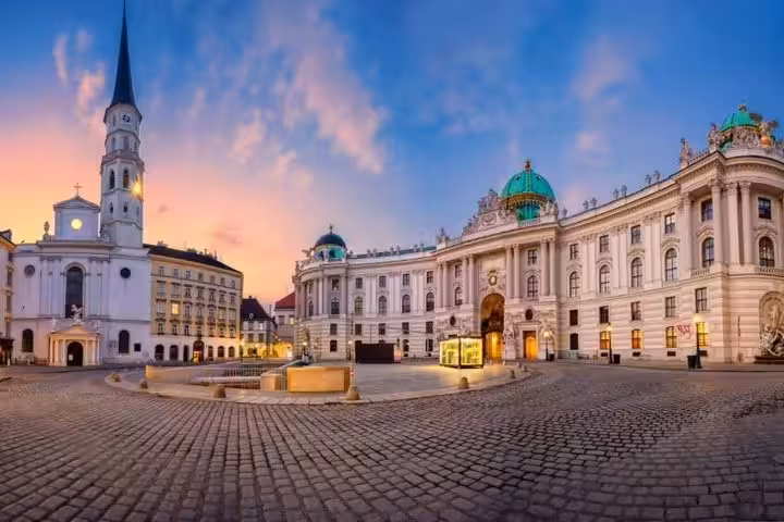 Vienna Hofburg Palace at sunset, landmark view for Vienna to Budapest private one-way transfer with Bratislava stop
