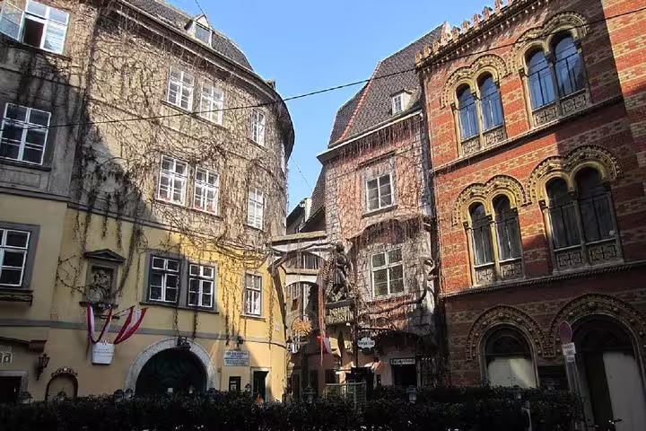 Historic medieval courtyard with ornate buildings in Vienna's old town on a sunny day