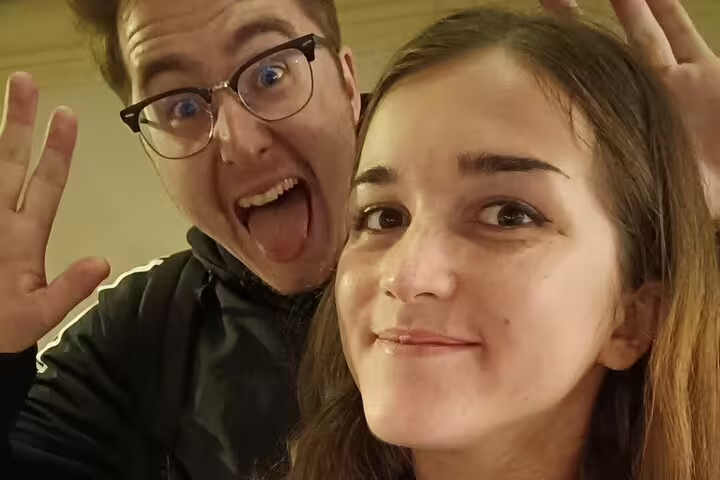 Two young tourists making funny faces on a Vienna self-guided tour
