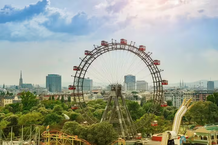Wiener Riesenrad giant Ferris wheel at Vienna Wurstelprater amusement park with city skyline