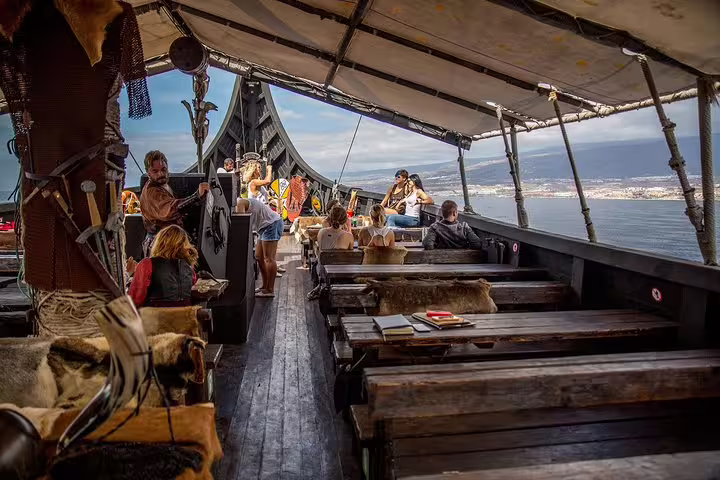 Guests enjoying the scenic view and Viking-themed activities on a spacious Nordic cruise ship deck.