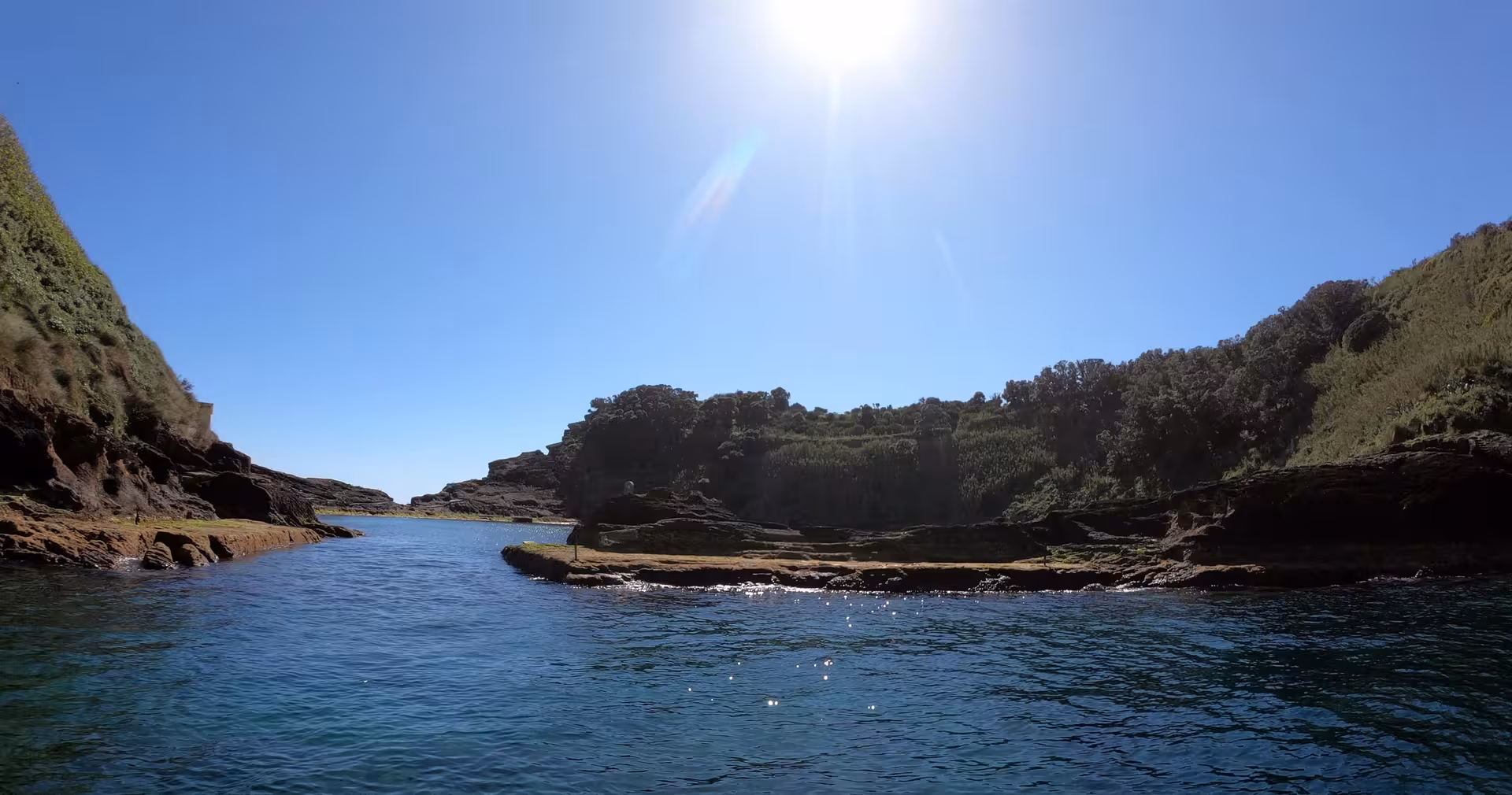 Calm lagoon entrance at Vila Franca do Campo Islet, São Miguel Azores, scenic boat tour waters